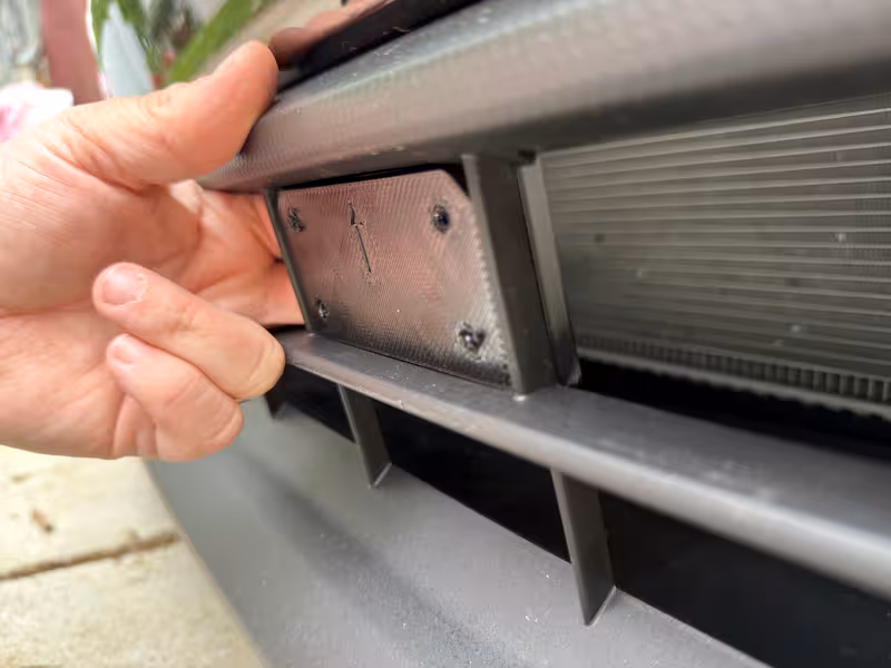 Step 1 — back mount inserted through grille