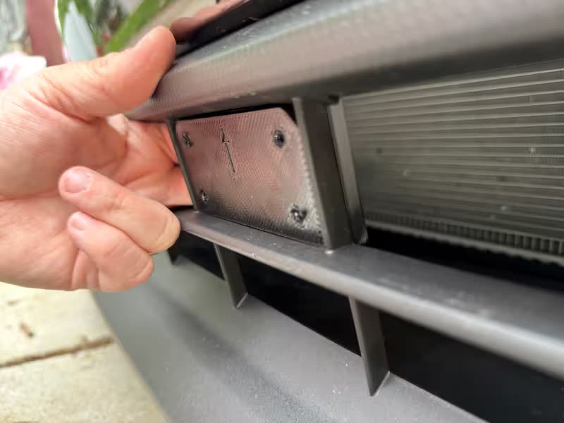 Step 1 — back mount inserted through grille